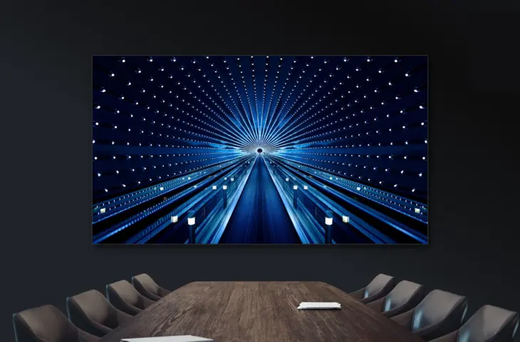 Grand, plus grand, le plus grand, jusqu&rsquo;à ce que cela ne rentre plus dans l&rsquo;ascenseur : à propos des écrans dans les salles de réunion